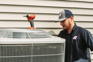 technician-works-on-condenser