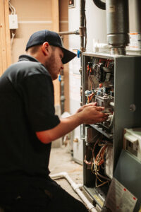 A1-technician-works-on-furnace