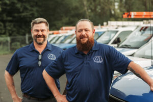 two-uniformed-HVAC-technicians