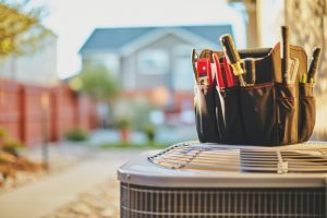 tools-sitting-on-outdoor-AC-unit