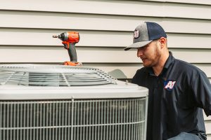 A1-HVAC-technician-repairing-outdoor-unit